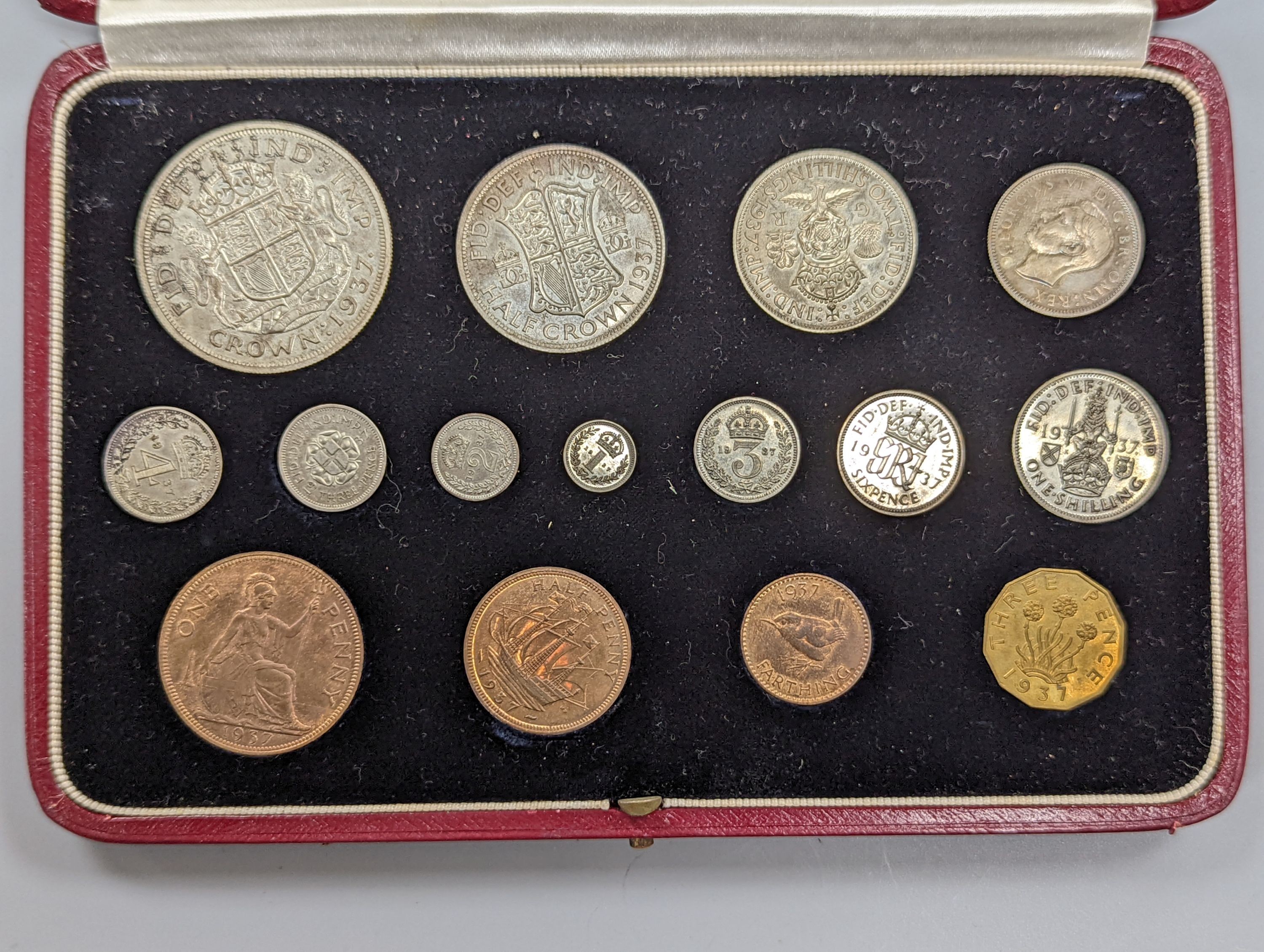 A cased George V coronation year 1937 specimen coin set, all toned UNC.